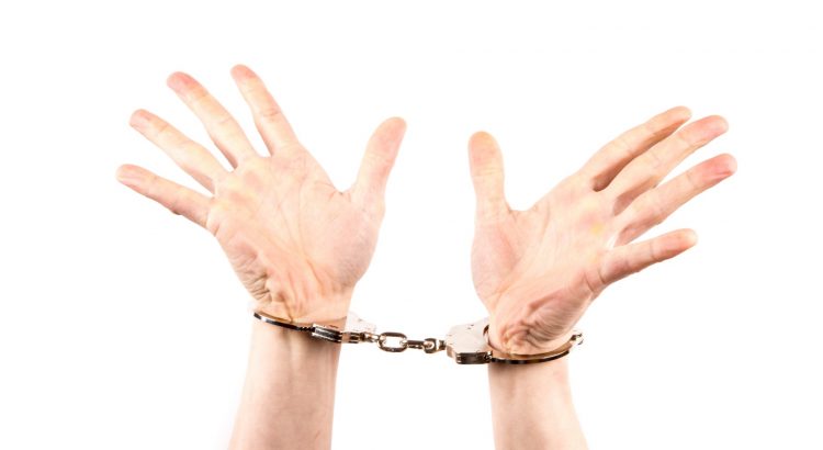 hands-in-handcuffs-14626087066Px